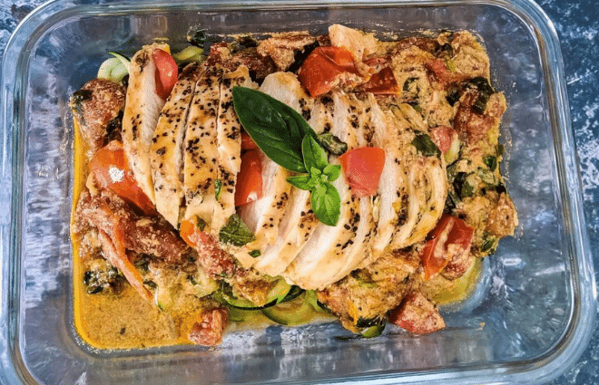 creamy tomato basil chicken in storage container