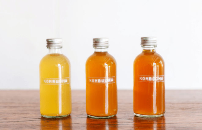 Three bottles of Kombucha in different flavors